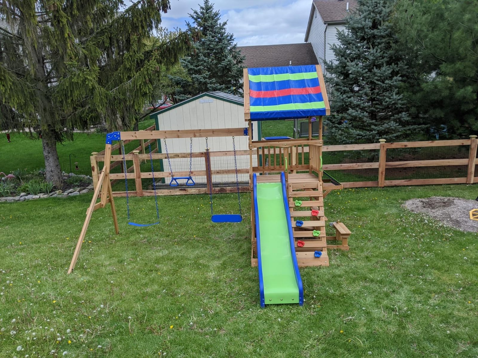 Backyard Discovery Belmont Cedar Wood Swing Set with Wave Slide, Play Deck, Rock Wall Ladder, Snack Bar Window, Shaded Picnic Area, Bench, Belt Swings, Trapeze, Sandbox Area, Canopy, Outdoor Playset customer photo 1
