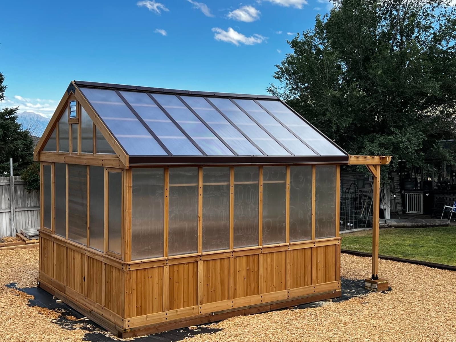 Backyard Discovery Bellerose 11' x 7' Cedar Wood and Polycarbonate Walk-In Greenhouse Kit with Pergola, Exhaust Fan, Windows, Hose Hook-Ups, PowerPort, Staging Shelves for Year-Round Outdoor Gardening customer photo 1