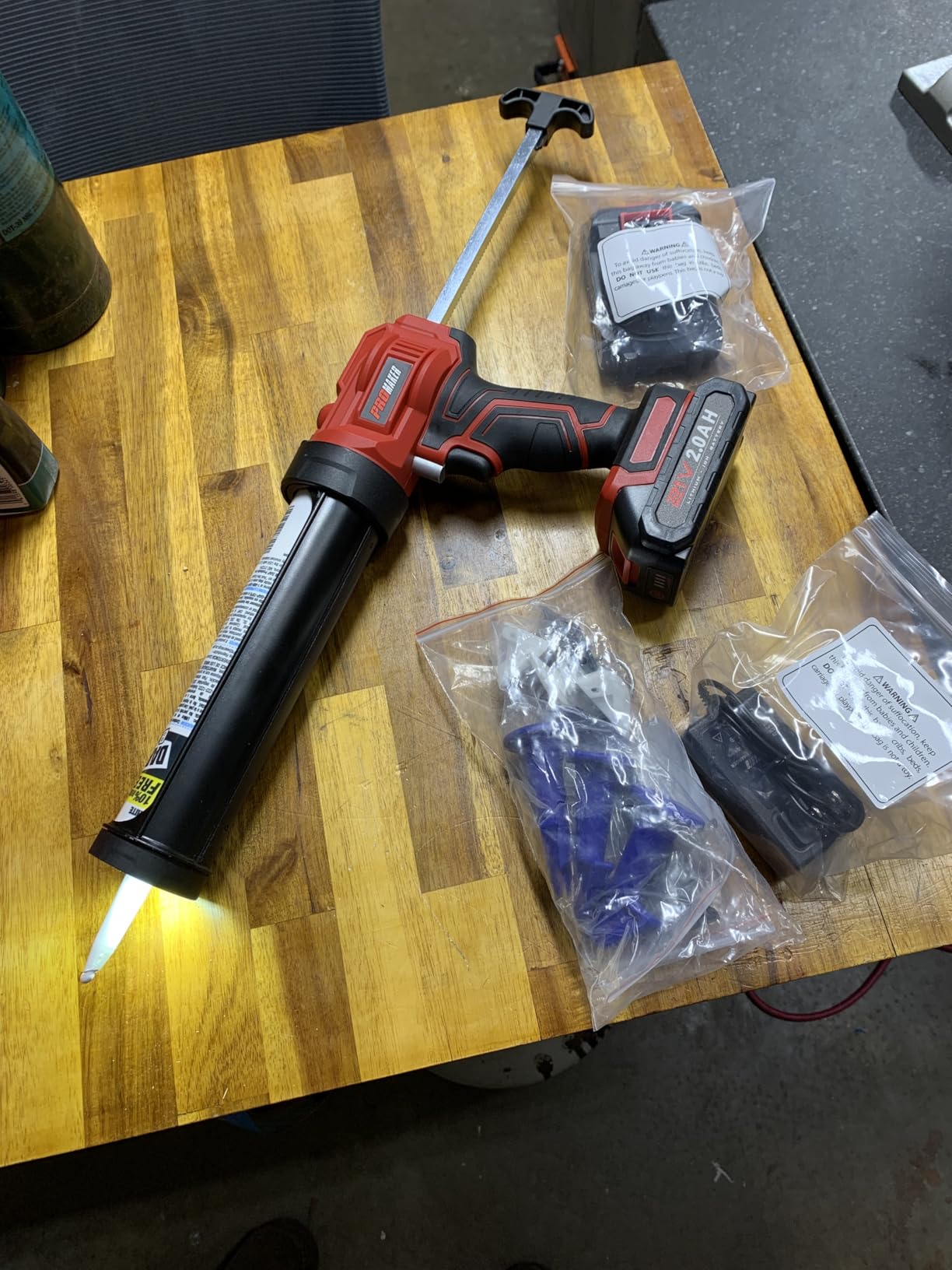 PROMAKER Cordless Caulking Gun, 21V Caulk gun w/ 2 Batteries, LED Light, Adjustable Speed, 3 Nozzle Adapters, 5 Knife Heads, 10 Oz Capacity, 550Lb Pushing Force, Caulk Tool Trowel & Scraper customer photo 1