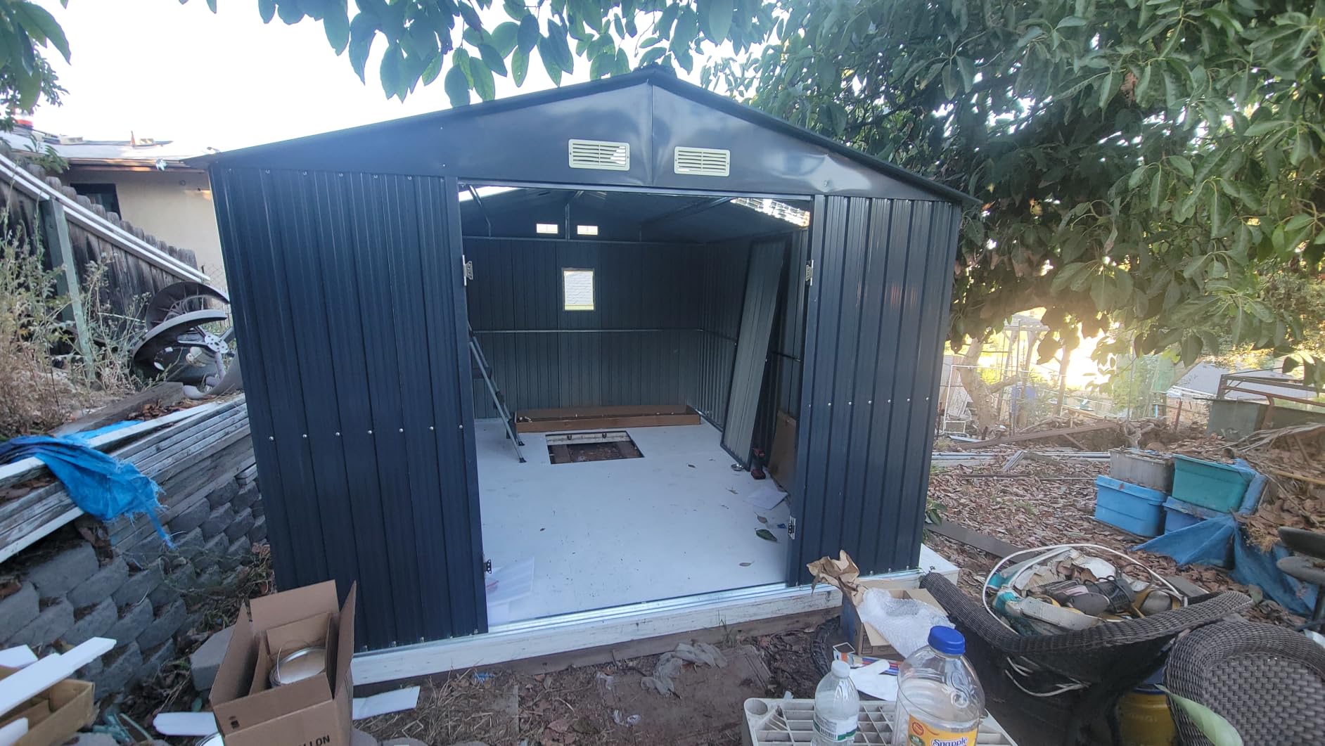 Breezz Outdoor Steel Storage Shed, 10 x 12 ft, Brown | Lockable doors, windows and skylight panels; ideal for storing garden tools, lawn equipment and seasonal decorations customer photo 1