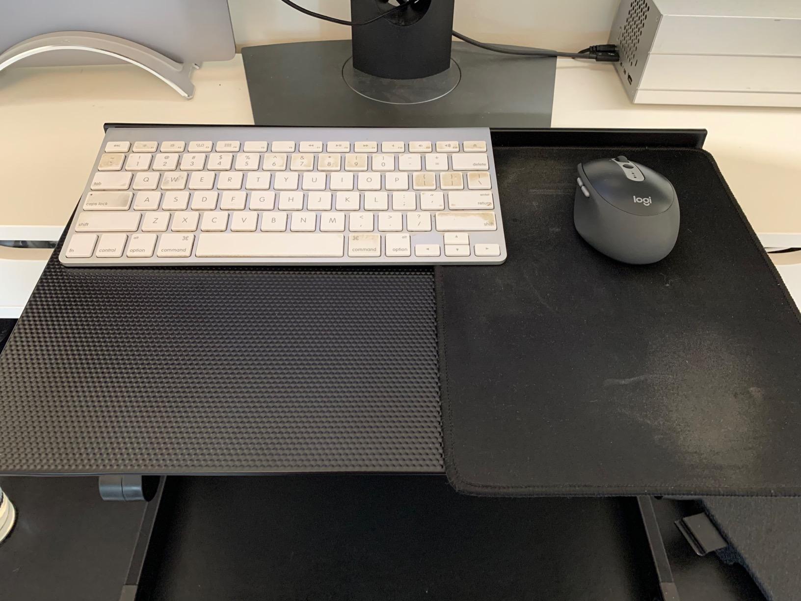 Uncaged Ergonomics WorkEZ Adjustable Keyboard Stand, Riser and Tray, Black | A keyboard shelf that rises to 18 in, 18 x 11 in aluminium, negative tilt, mouse pad on either side. customer photo 1