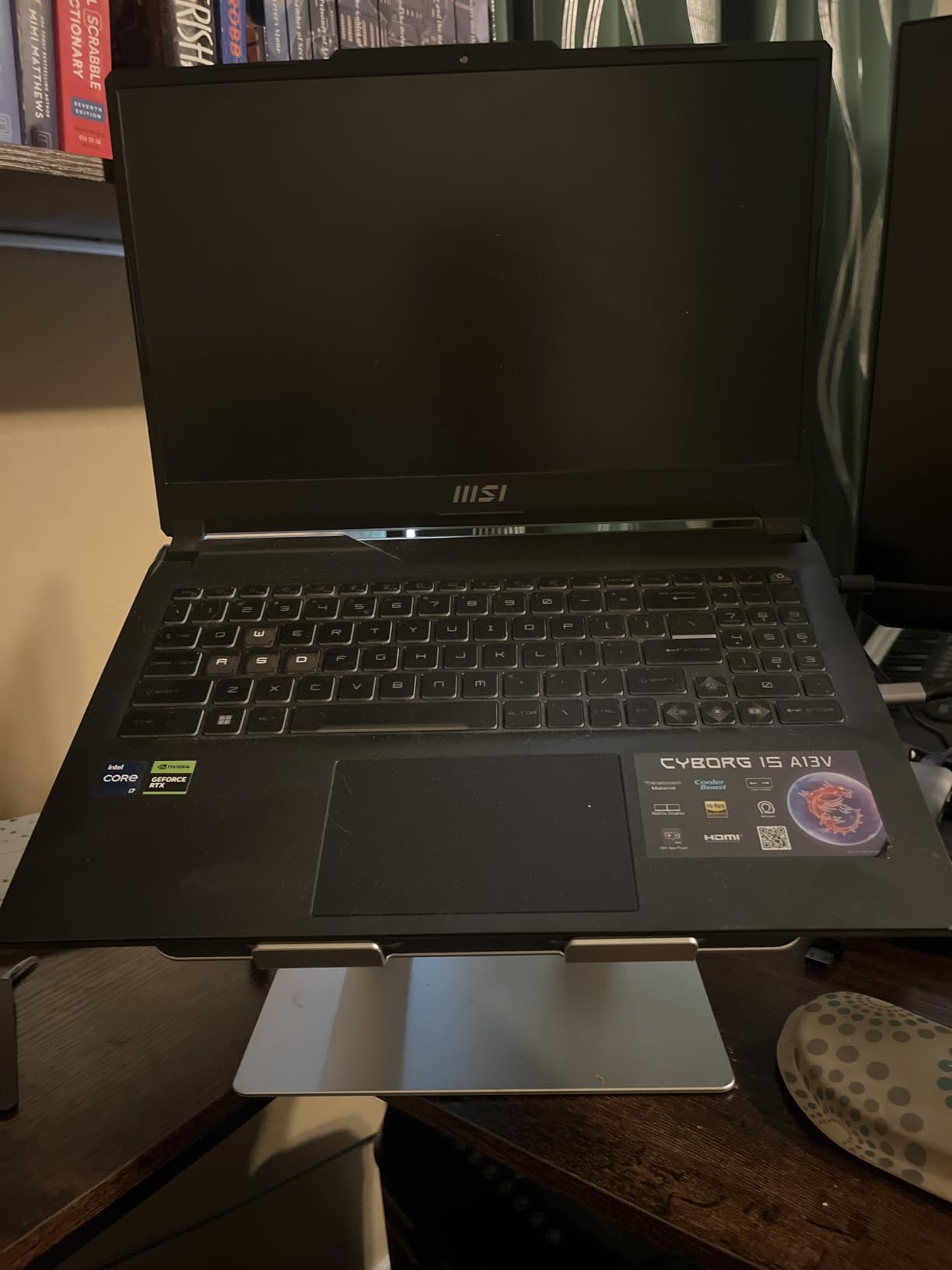 Amazon Basics Sturdy and Portable Ergonomic Laptop Stand for Desk, Height Adjustable Riser with Ventilated Cooling, Foldable, Fits all Laptops up to 15.6 Inch, Silver customer photo 1