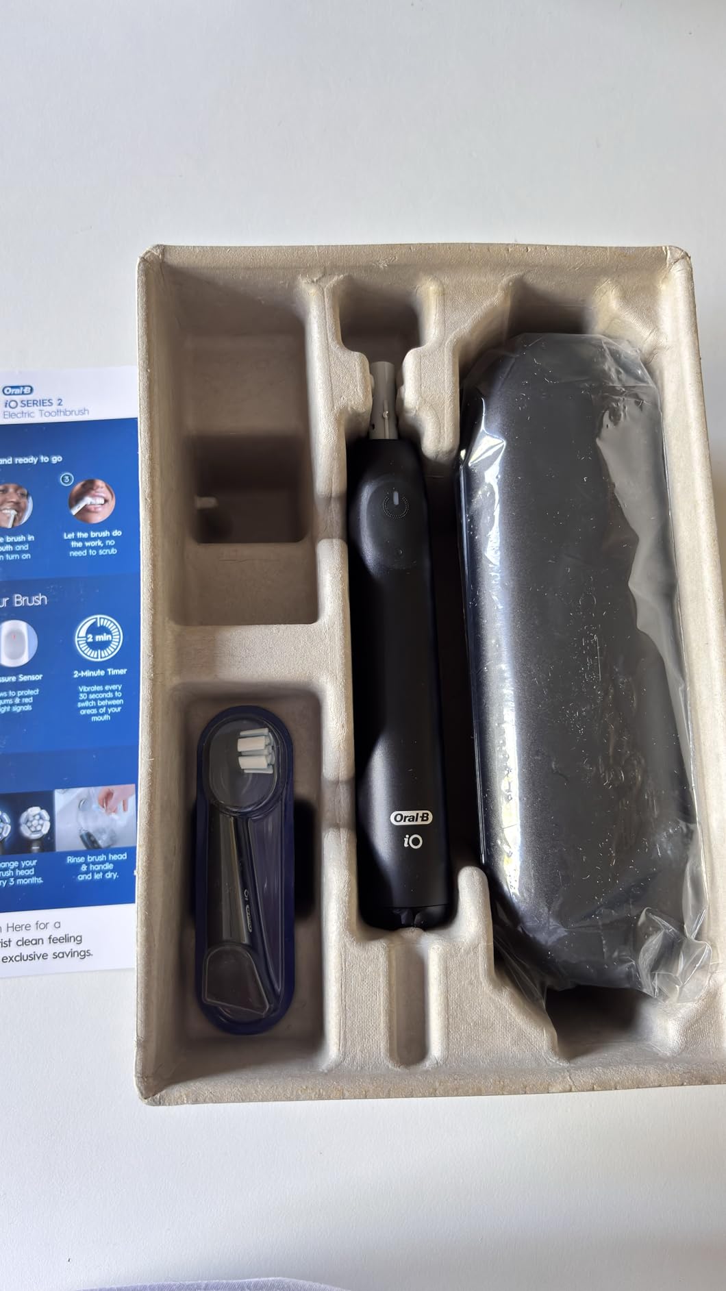 Oral-B Rechargeable Electric Toothbrush, iO Limited Simple Clean, 3 Cleaning Modes, Automatic Pressure Sensor to Protect Gums, Travel Case, White customer photo 1