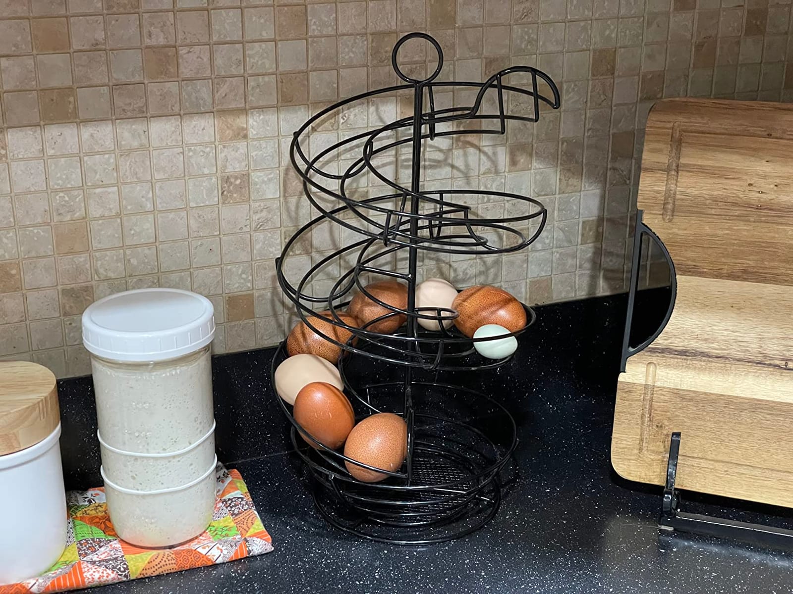 QUTREY Black Metal Egg Holder Countertop, Fresh Egg Skelter, Spiral Design Egg Dispenser Rack with Storage Basket for Display Easter Eggs customer photo 2